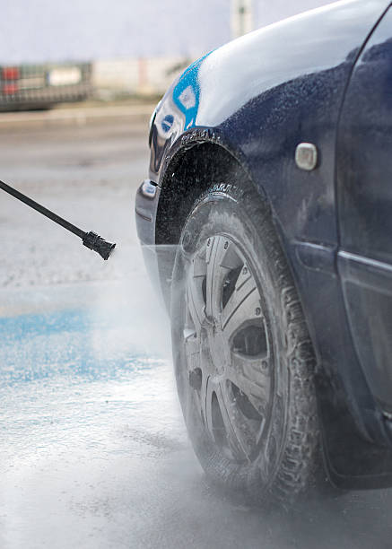 istock Blue car wash using high pressure water jet. 471993728