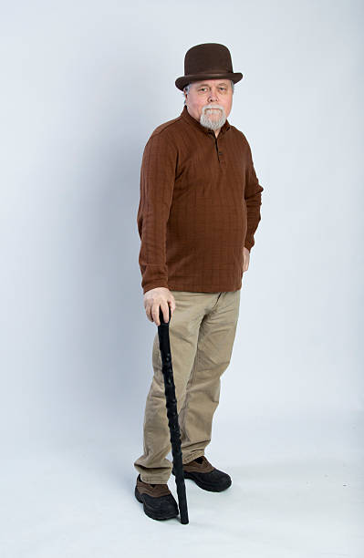 istock Elderly gentleman wearing leaning on a black walking stick 471995384