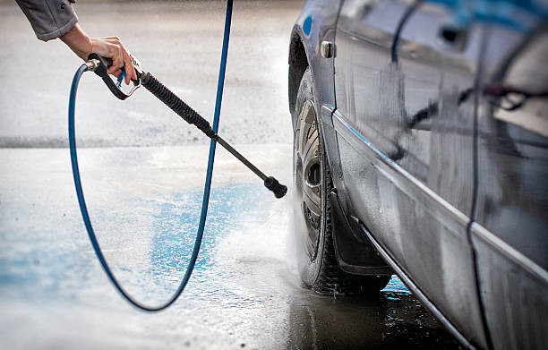 istock Blue car wash using high pressure water jet. 471996350