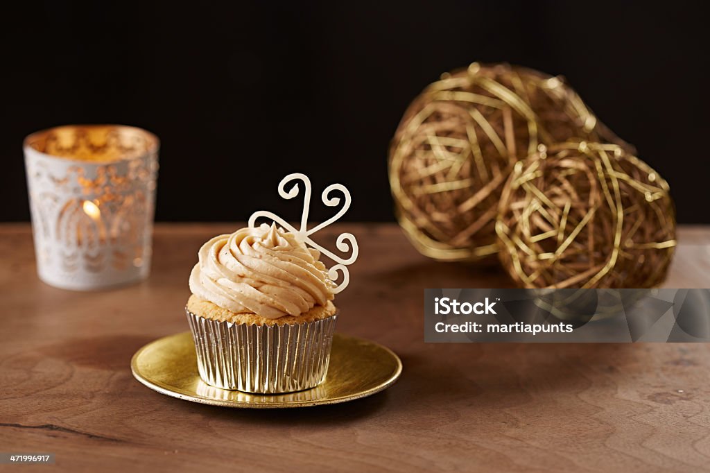 Snowflake cupcake on Christmas background Snowflake cupcake on black Christmas background Baked Stock Photo