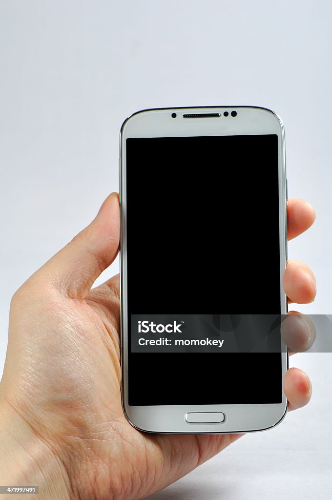 Holding a smart phone with blank screen isolated on white A young man holding a smart phone to show the blank screen Blank Screen Stock Photo