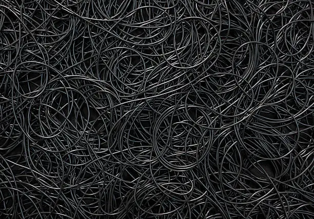 Background covered with a pile of electric cords filling the entire frame