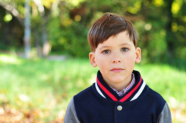 istock Schoolboy in the park 471998137