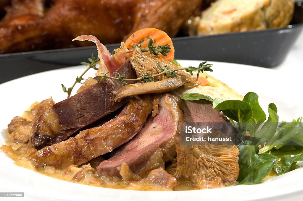 Baked duck Baked duck with bacon and mushrooms Apple - Fruit Stock Photo