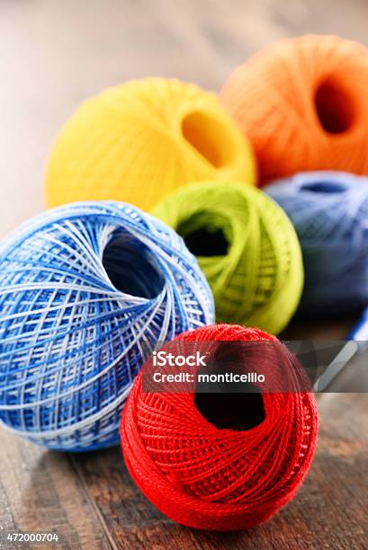 Colorful Yarn For Crocheting And Hook On Wooden Table Stock Photo - Download Image Now