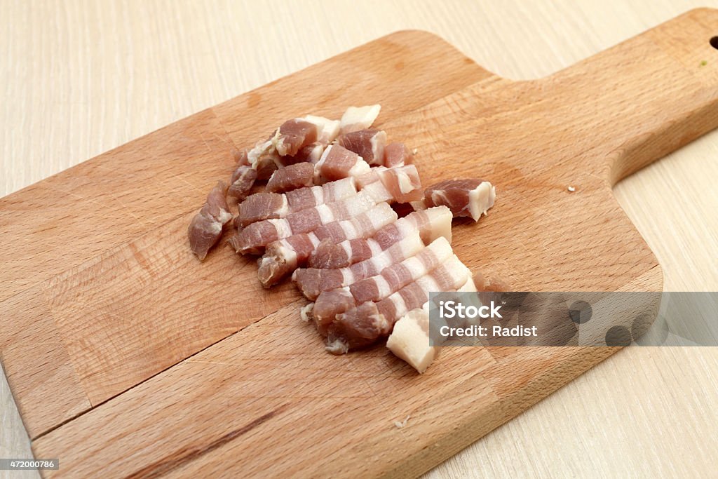 Slices of bacon Slices of bacon on a wooden cutting board 2015 Stock Photo