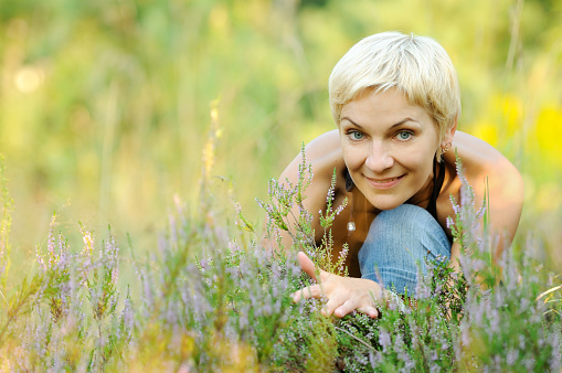 portrait of look well smiling middle aged woman outdoors
