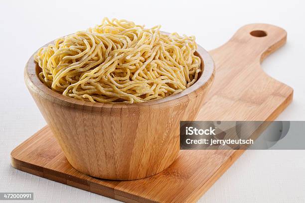 Bowl Of Ramen Noodles On A Cutting Board Stock Photo - Download Image Now - Asian Culture, Asian Wheat Noodles, Bamboo - Material