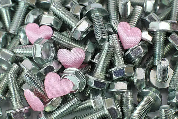 Small pink fabric hearts in screws