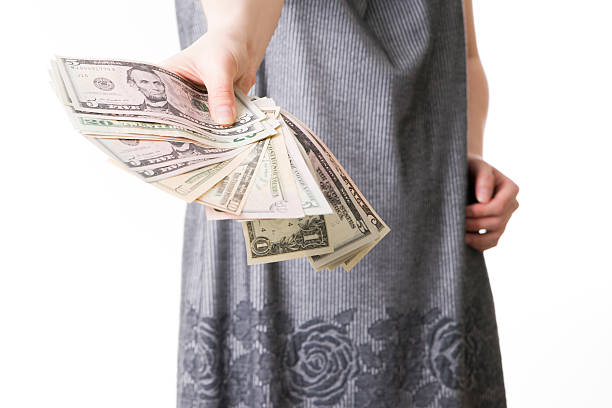 istock Woman with money in studio 472002596