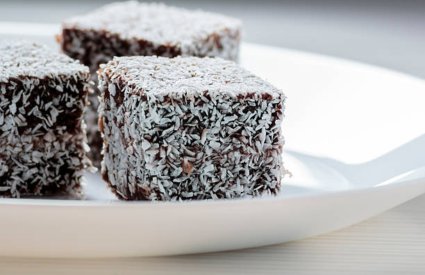 istock Australian Lamington cake on white plate 472002744