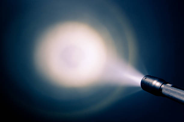 A small pocket flash light shining on the wall focused glowing pocket torch light searchlight photos stock pictures, royalty-free photos & images