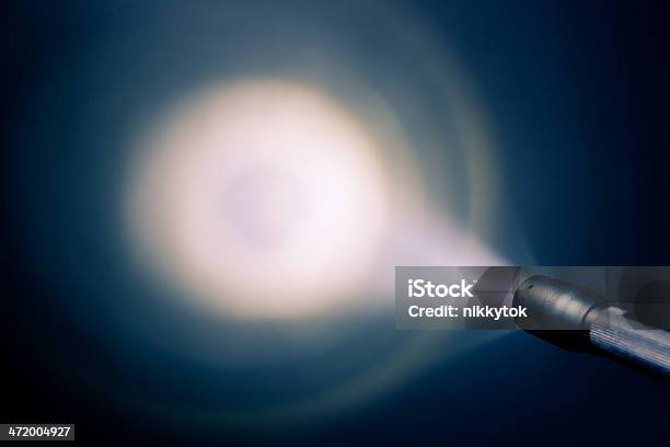 A Small Pocket Flash Light Shining On The Wall Stock Photo - Download Image Now - Flashlight, Shiny, Spotlight