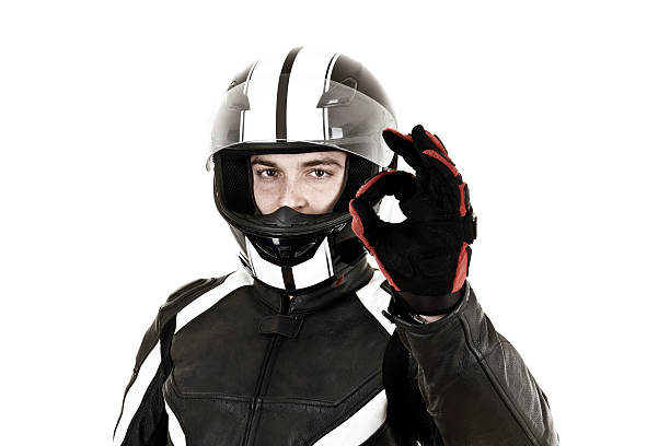 istock A biker man wearing a helmet with an okay sign  472006414