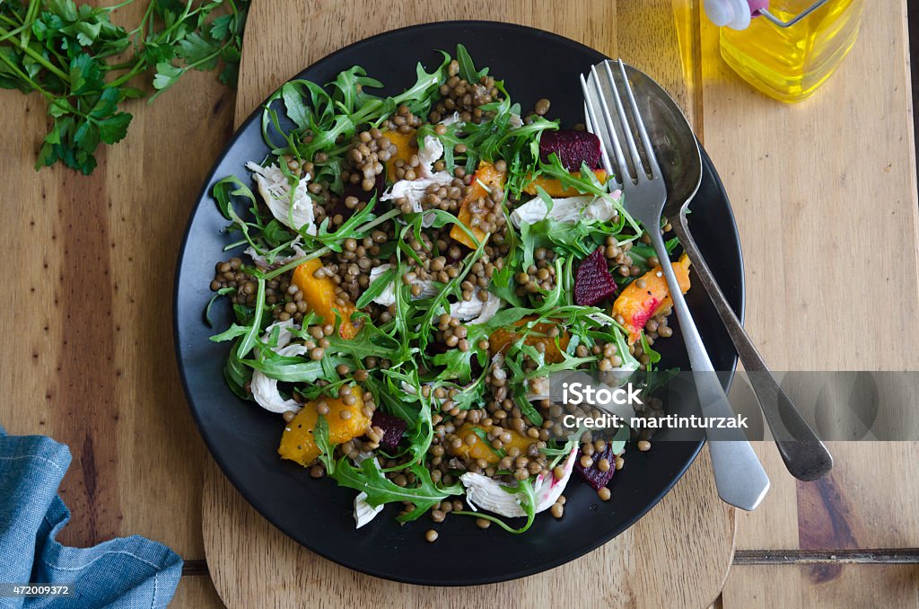 A delicious platter of chicken, lentil and squash medley Shredded chicken, puy lentil and beetroot salad Lentil Stock Photo