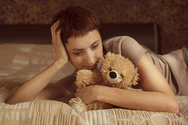istock Pretty girl with a teddy bear 472011493