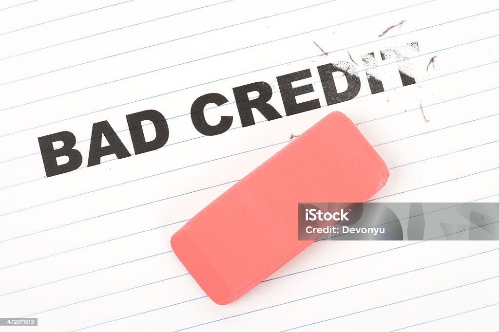 eraser and word bad credit eraser and word bad credit, concept of making change Debt Stock Photo
