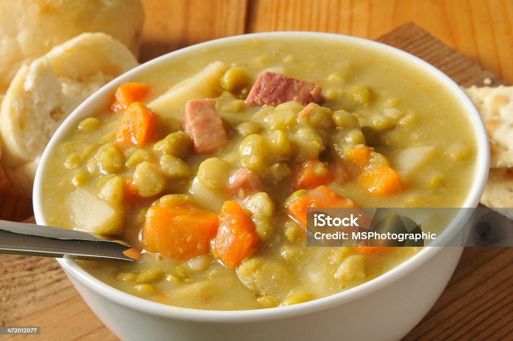 Split pea soup A bowl of split pea soup with ham Bowl Stock Photo