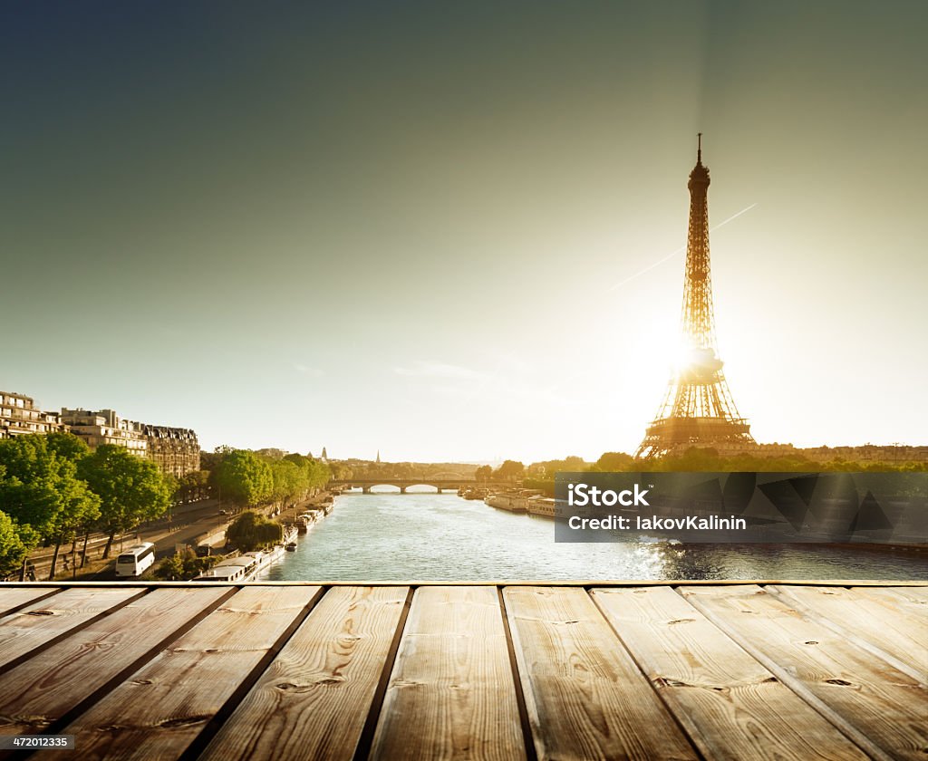 background with wooden deck table and  Eiffel tower in Paris Architecture Stock Photo