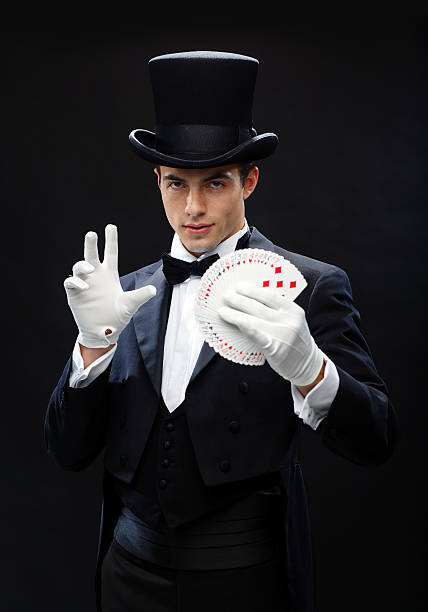 istock magician showing trick with playing cards 472013567