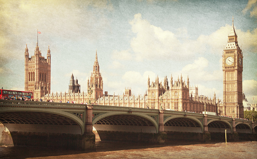 The Palace of Westminster, Elizabeth Tower and Westminster Bridge. Toned image. aged paper texture.