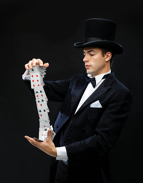 magician showing trick with playing cards