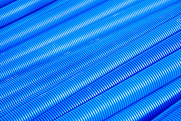 Blue corrugated pipe for electrical high-voltage cables Blue corrugated pipe for electrical high-voltage cables pvc conduit stock pictures, royalty-free photos & images