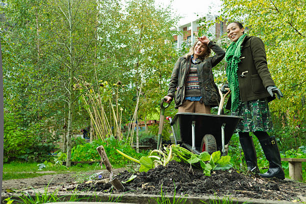 Two Women Working In A Garden
