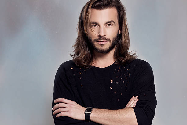istock Portrait of a smart serious young man standing 472016193