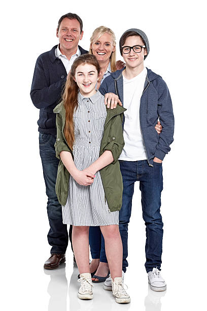 istock Happy young family standing together over white 472017500