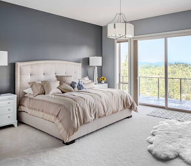Master Bedroom in New Luxury Home Furnished master bedroom in new home owners bedroom photos stock pictures, royalty-free photos & images