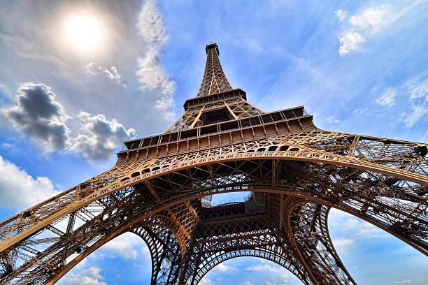 istock Eiffel Tower, Paris, France upward view with sun 472021122