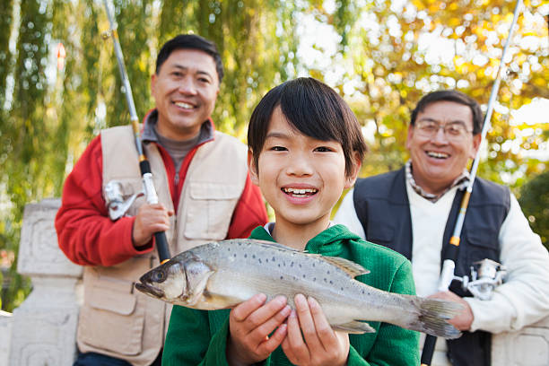 istock Multi-generational men fishing portrait 472021239