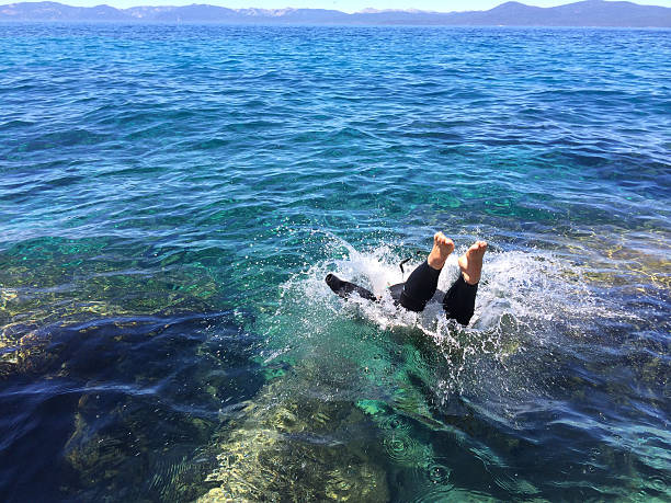 istock Person dives into a cold mountain lake 472021622