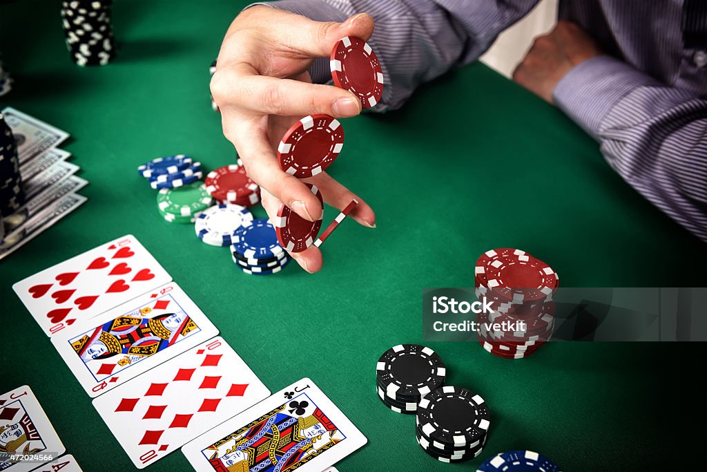 gambler gambler is going to make a bet in poker Gambling Chip Stock Photo