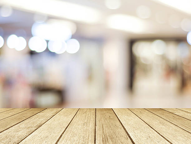 istock Perspective wood and blurred store with bokeh background 472024600