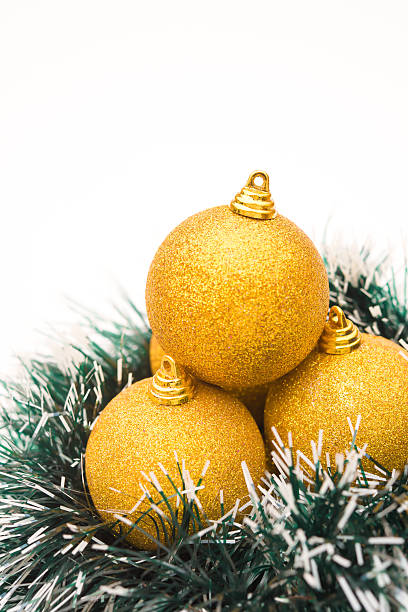 istock golden christmas balls on white, vertical 472026733