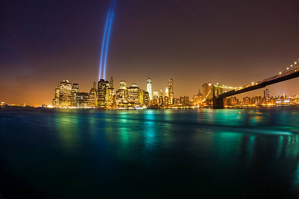 istock Manhattan Skyline and Brooklyn Bridge with 11 September Lights 472027053