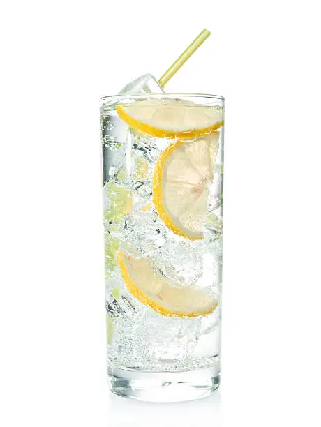 Gin and tonic cocktail with lemon over white background