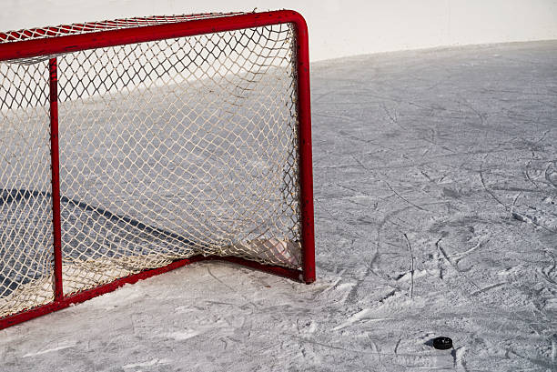 istock Ice Hockey Goal / Net and Puck with Used Ice 472028042