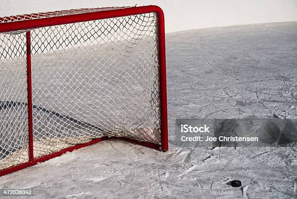 Ice Hockey Goal Net And Puck With Used Ice Stock Photo - Download Image Now - 2015, Goal - Sports Equipment, Hockey Puck