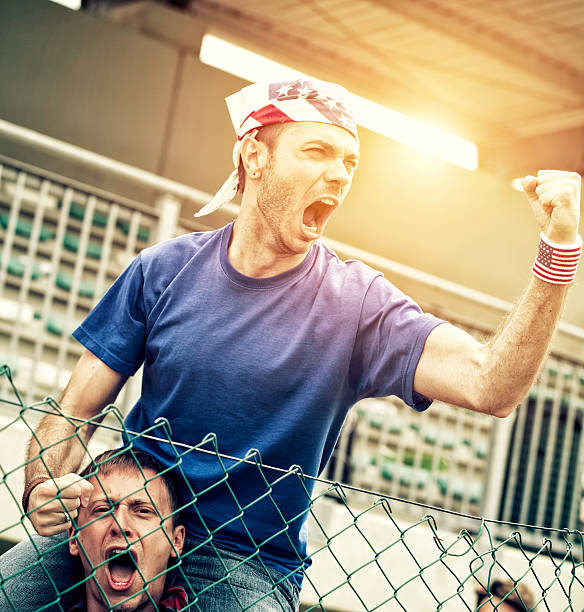istock Sports fans cheering a game 472029283