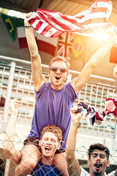 istock Sports fans cheering a game 472029297