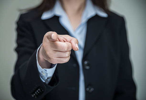 istock Woman pointing at you with one finger 472030381