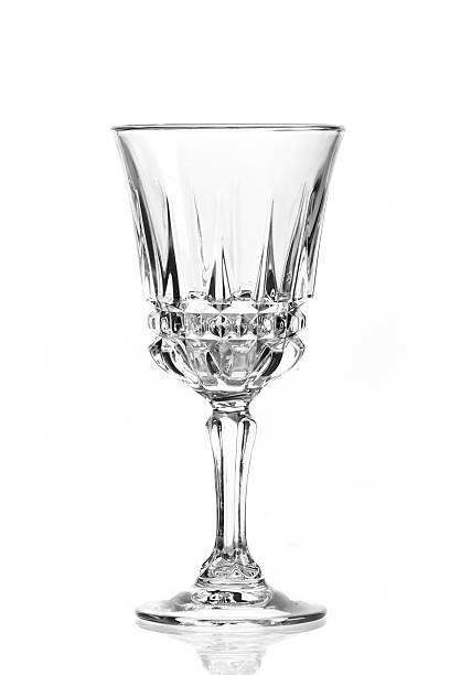 Wine glass isolated Single empty wine glass. Isolated on a white background. Black and white image. crystal glassware stock pictures, royalty-free photos & images