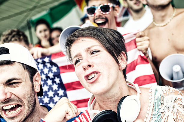 istock Sports fans cheering a game 472031323