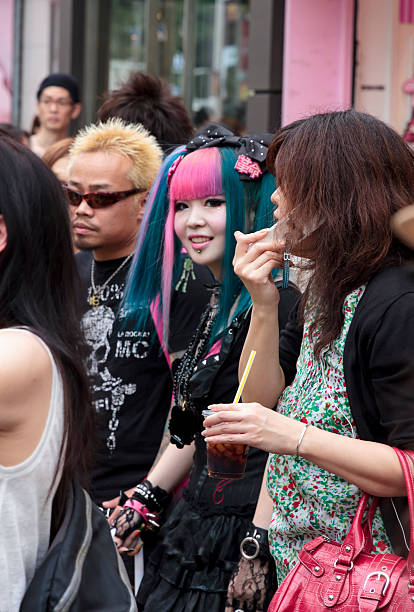 Young subcultural couple standing in the crowd, Tokyo stock photo