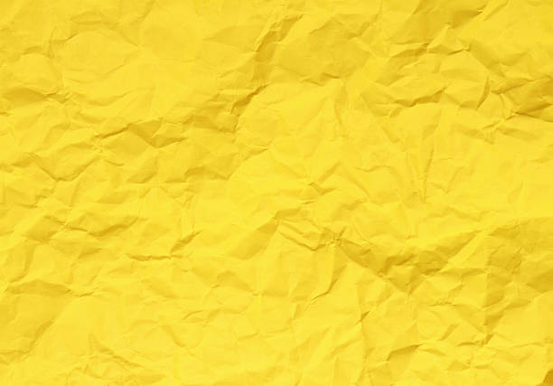 istock Yellow paper with texture due to crumpling for background 472031654