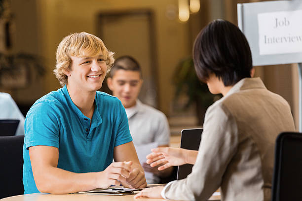 istock Employer interviewing high school age boy for job position 472032027