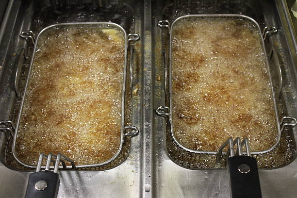 istock french fries in frying baskets 472032173